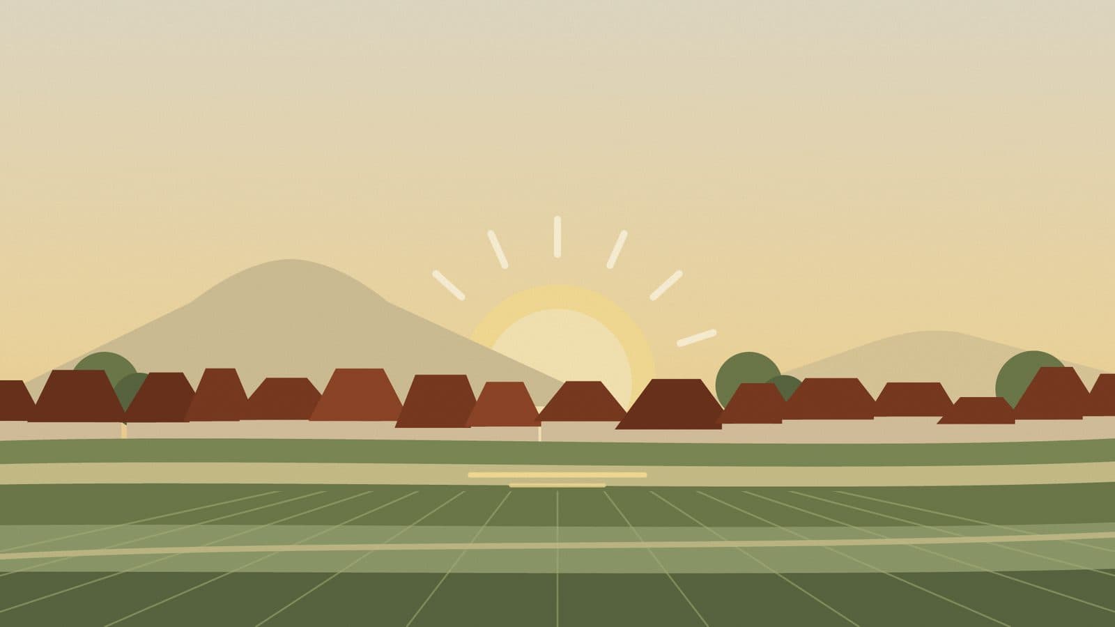 Fajar: matahari terbit di atas genteng dan sawah
