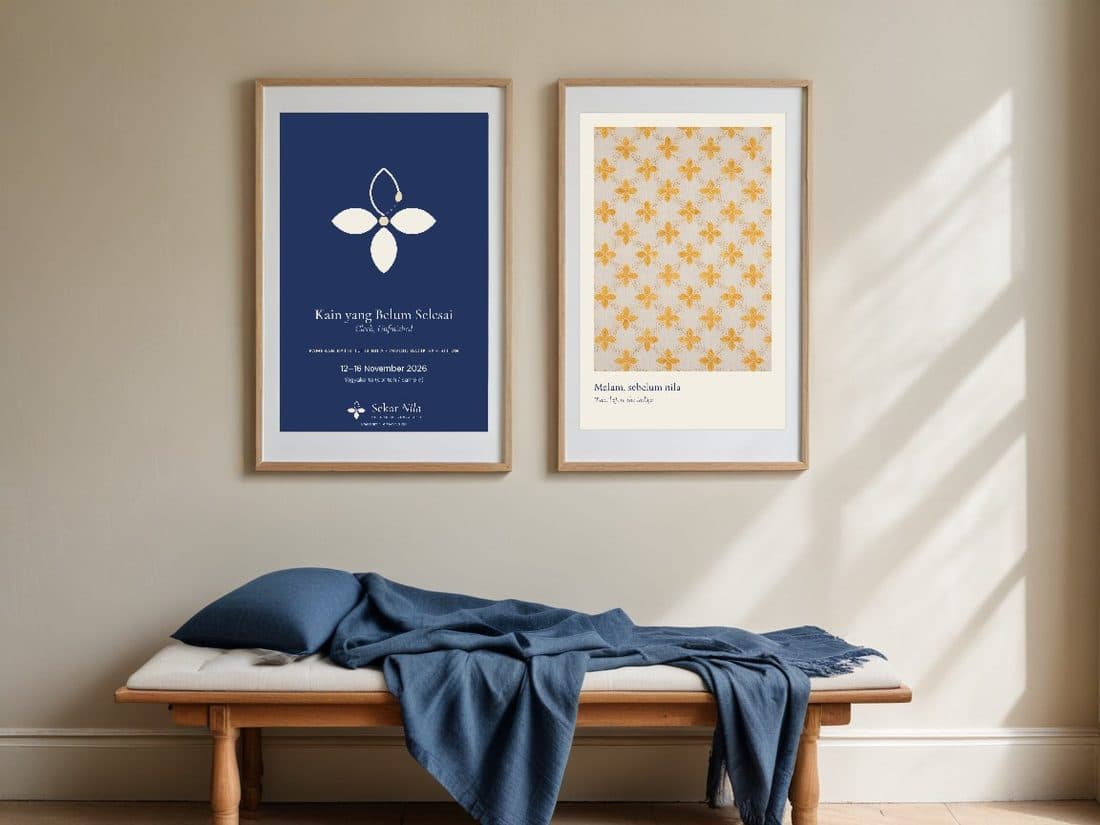 Framed exhibition poster and wax-stage print on a wall